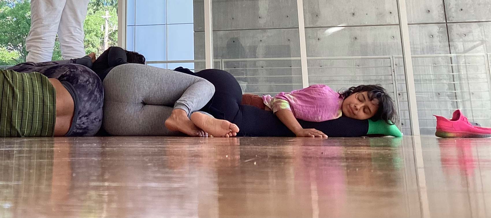 Women laying on floor next to each other